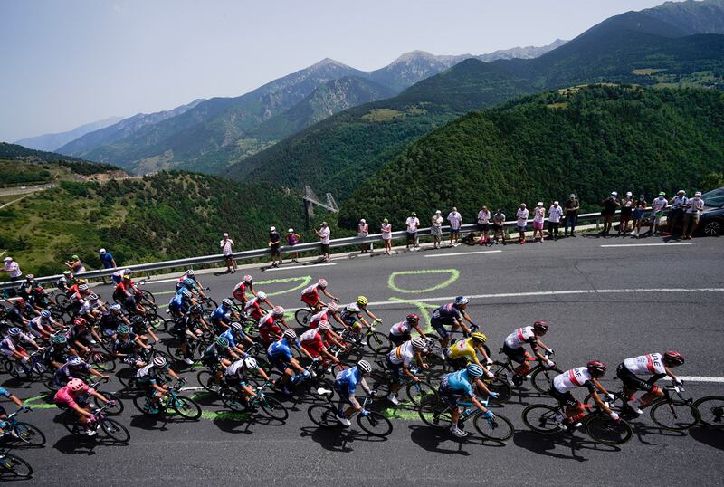 The peloton climbs towards Col de Puymorens pass during Stage 15.