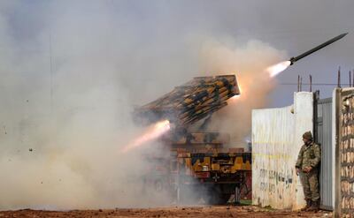 TOPSHOT - A Turkish military mobile rocket launcher fires from a position in the countryside of the Syrian province of Idlib towards Syrian government forces' positions in the countryside of neighbouring Aleppo province on February 14, 2020.  / AFP / Omar HAJ KADOUR
