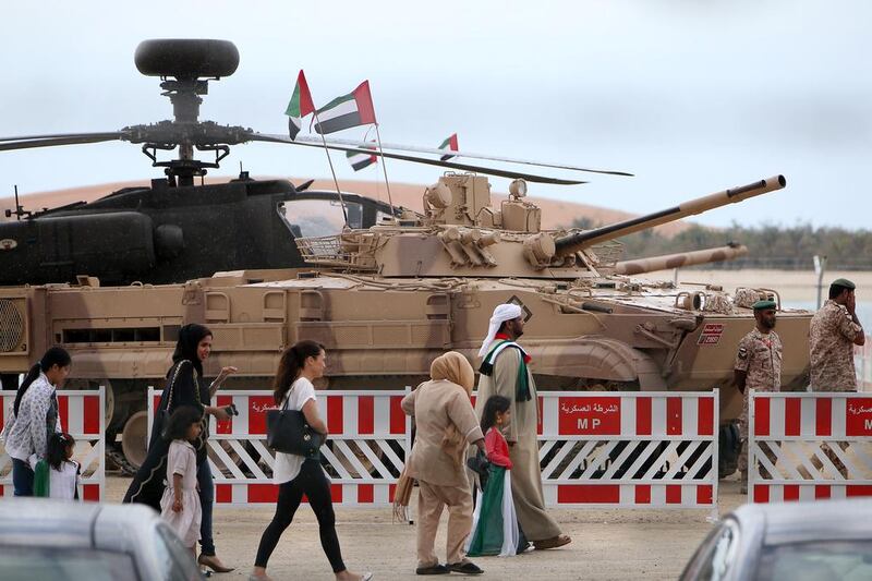 People at the UAE Armed Forces exhibition on the Corniche in Abu Dhabi. Pawan Singh / The National