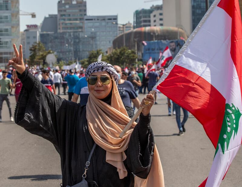 Anti-government protestors during a mass protest against the economic and financial crisis, and to demand early parliamentary elections, in Beirut, Lebanon.  EPA