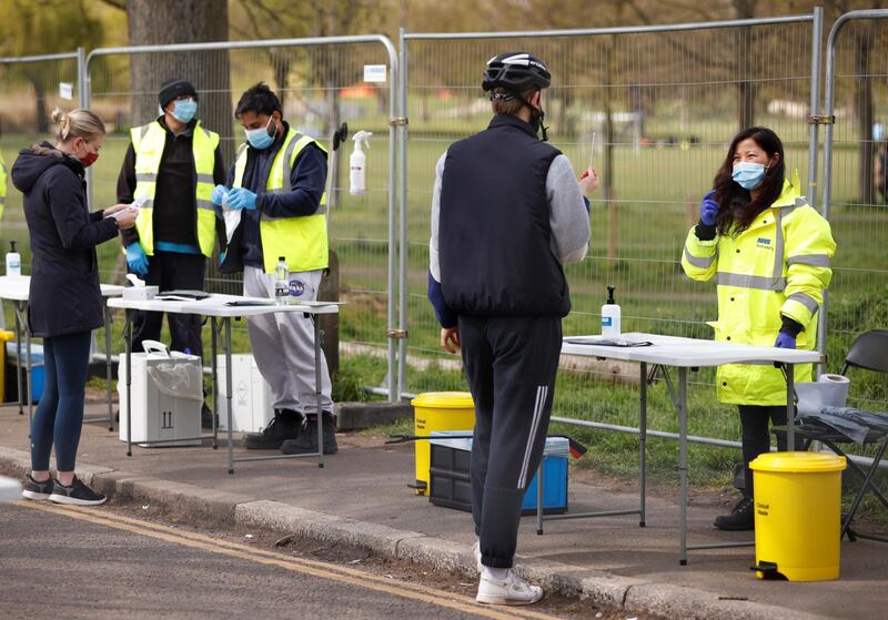 People take coronavirus disease (COVID-19) tests on Clapham Common in London, Britain, April 14, 2021. REUTERS/John Sibley