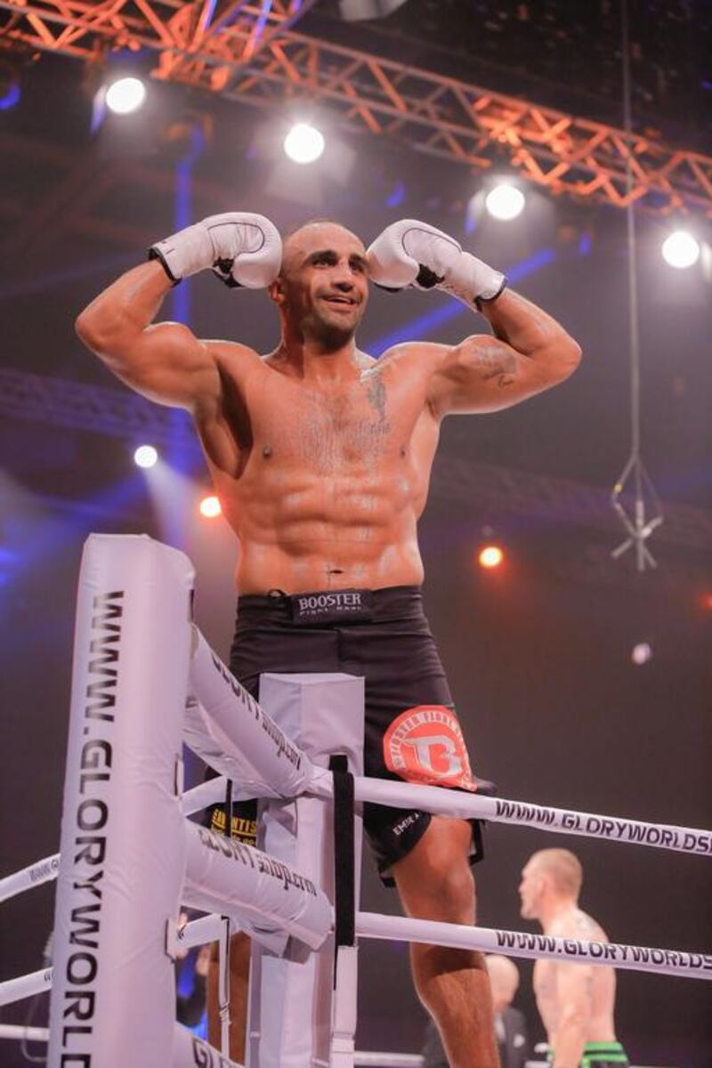 Mourad Bouzidi climbs the ropes to celebrate his win over Dustin Jacoby. Victor Besa / The National