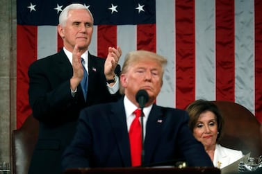 US Vice President Mike Pence applauds as Speaker of the House Nancy Pelosi looks at a copy of the speech after President Donald Trump delivered his State of the Union address. EPA