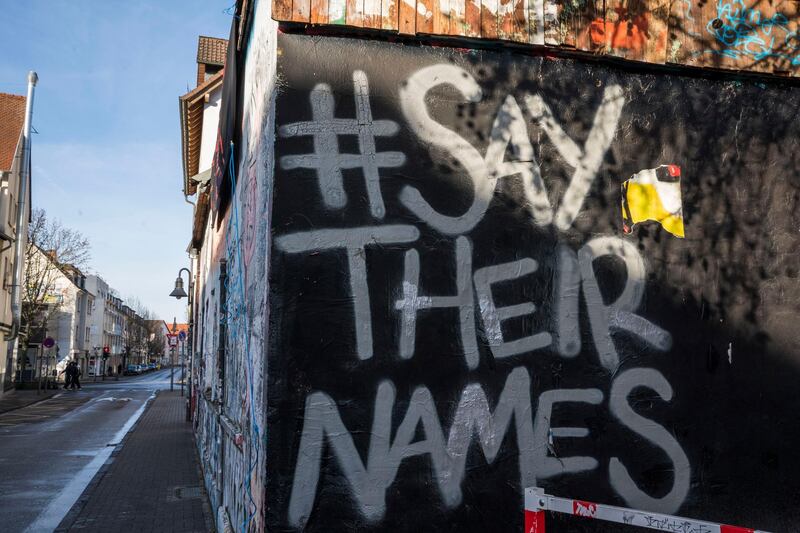Graffiti on the wall of a house reads 'Say their names' in Hanau. Getty Images