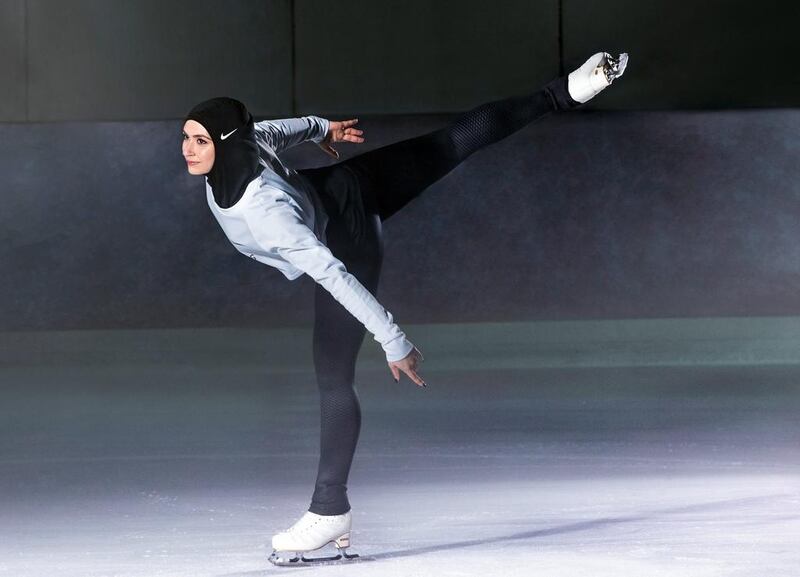 Figure skater Zahra Lari wears Nike's new hijab for Muslim female athletes. The pull-on hijab is made of light, stretchy fabric that includes tiny holes for breathability and an elongated back so it will not come untucked. It will come in three colors: black, vast grey and obsidian. Beaverton-based Nike says the hijab will be available for sale next year. Nike via AP