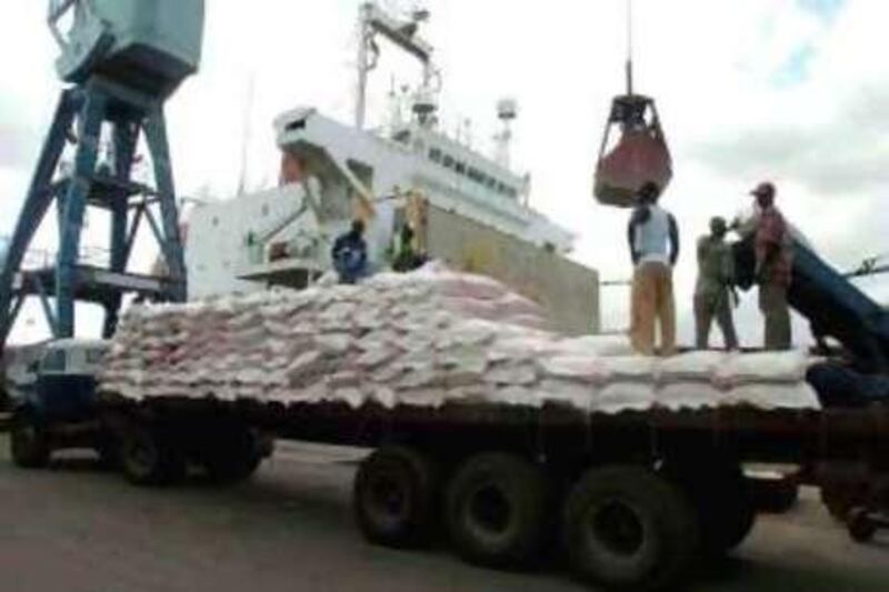 Maize imports from South Africa are loaded onto a truck at the coastal port of Mombasa in this March 4, 2009 file photo.  Barely a week goes by without a new multi-million dollar corruption scandal, such as irregularities in the purchase of maize to feed starving Kenyans during a drought, being splashed on the front pages of Kenya's newspapers: mostly with names, dates and amounts.  Picture taken March 4, 2009. To match feature KENYA-CORRUPTION/ REUTERS/Stringer (KENYA - Tags: POLITICS AGRICULTURE CRIME LAW)