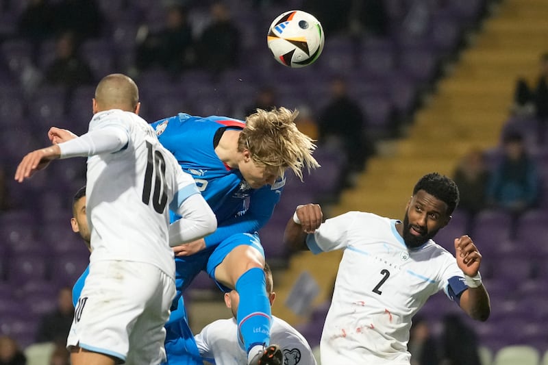 Iceland's Andri Gudjohnsen heads the ball during the Euro 2024 qualifying play-off match. AP