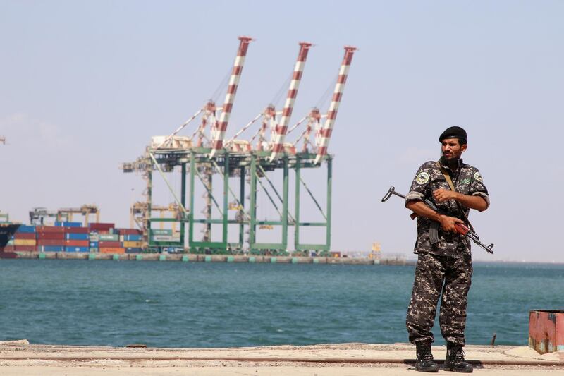 FILE PHOTO: A police trooper stands guard near the Aden port in Aden, Yemen November 16, 2019. REUTERS/Fawaz Salman/File Photo