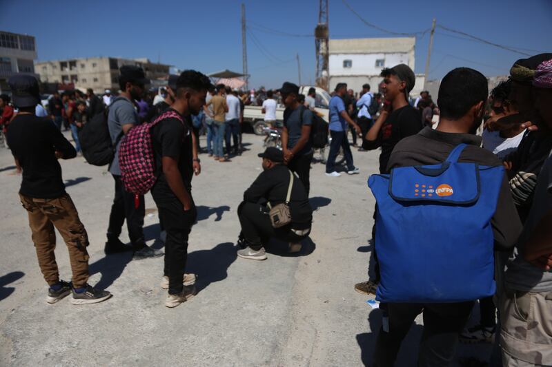 Thousands who want to leave head for the Bab al-Hawa crossing. 