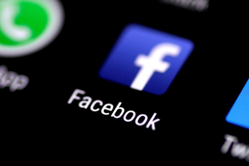FILE PHOTO: The Facebook application icon on a phone screen, August 3, 2017.   REUTERS/Thomas White/File Photo