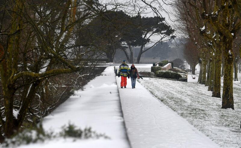 Pedestrians walk along a path in Brest, western France. Fred Tanneau / AFP Photo