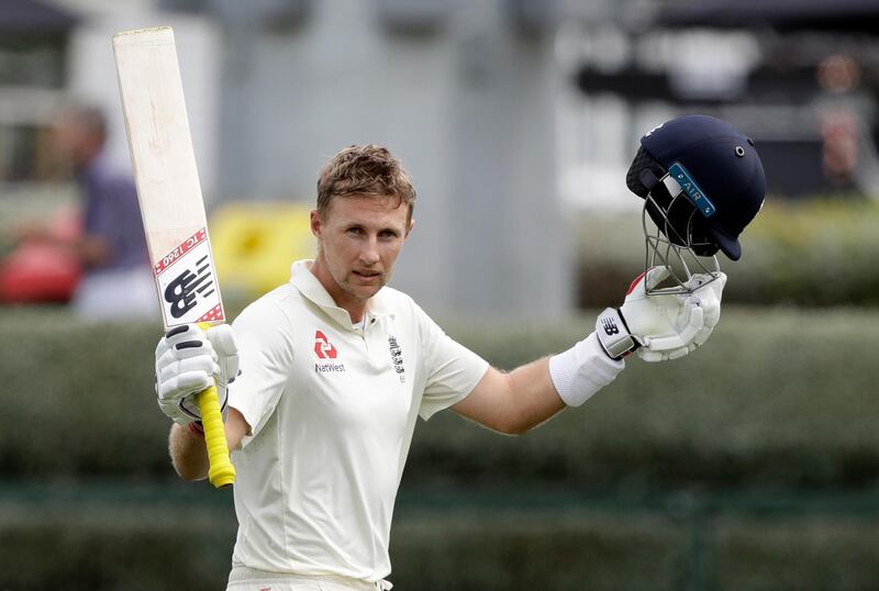 England's Joe Root waves to the crowd as he leaves the field after he was dismissed for 226 runs during play on day four of the second cricket test between England and New Zealand at Seddon Park in Hamilton, New Zealand, Monday, Dec. 2, 2019. (AP Photo/Mark Baker)