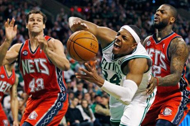 Paul Pierce, in white, scored 27 points against the Nets on Saturday night.