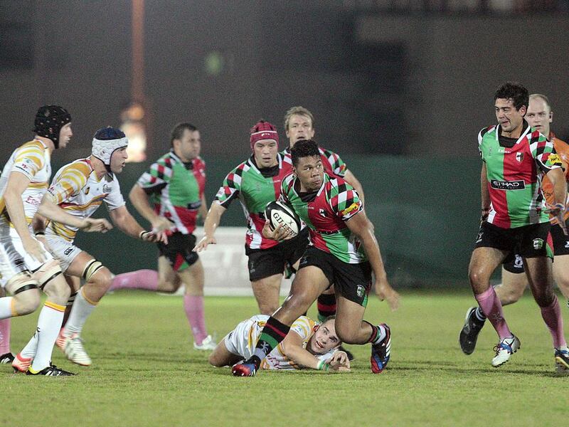 Mark Hibbs, in the red cap, and his Abu Dhabi Harlequins teammates fell 24-17 to Dubai Hurricanes in a UAE Premiership game on Friday night. Jeffrey E Biteng / The National