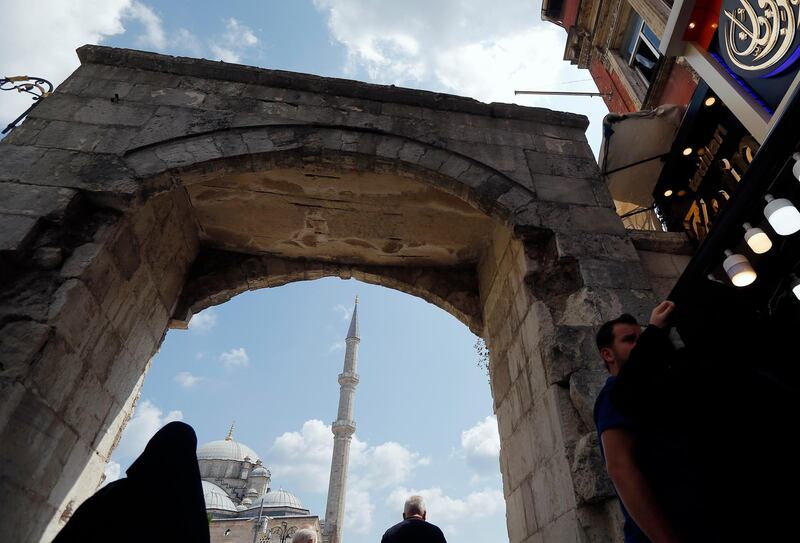 A man walks past Fatih mosque in Istanbul. Syrians say Turkey has been detaining and forcing some Syrian refugees to return back to their country the past month. The expulsions reflect increasing anti-refugee sentiment in Turkey, which opened its doors to millions of Syrians fleeing their country's civil war. AP Photo
