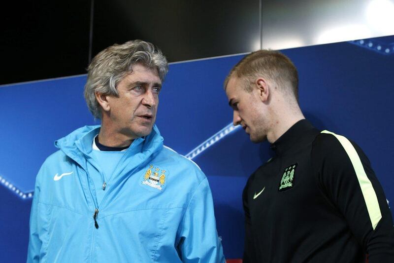 Manchester City manager Manuel Pellegrini and Joe Hart during a news conference. Reuters / Carl Recine