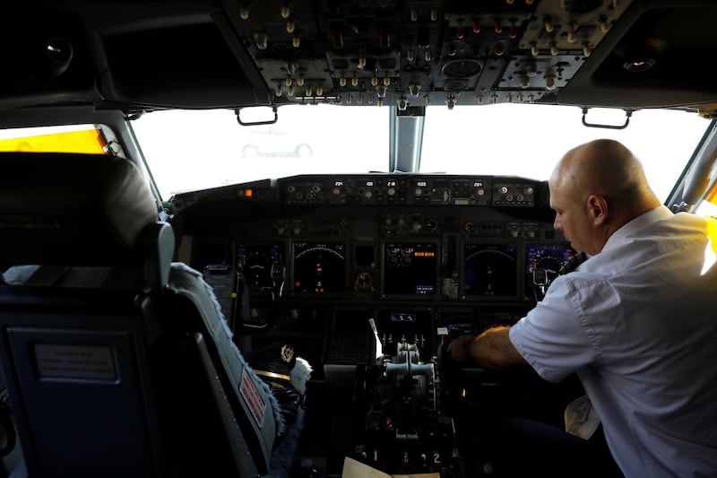 A pilot goes through pre-flight checks. Reuters