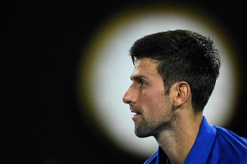epa07306344 Novak Djokovic of Serbia in action against Daniil Medvedev of Russia during their men's singles fourth round match at the Australian Open Grand Slam tennis tournament in Melbourne, Australia, 22 January 2019.  EPA/LUKAS COCH AUSTRALIA AND NEW ZEALAND OUT