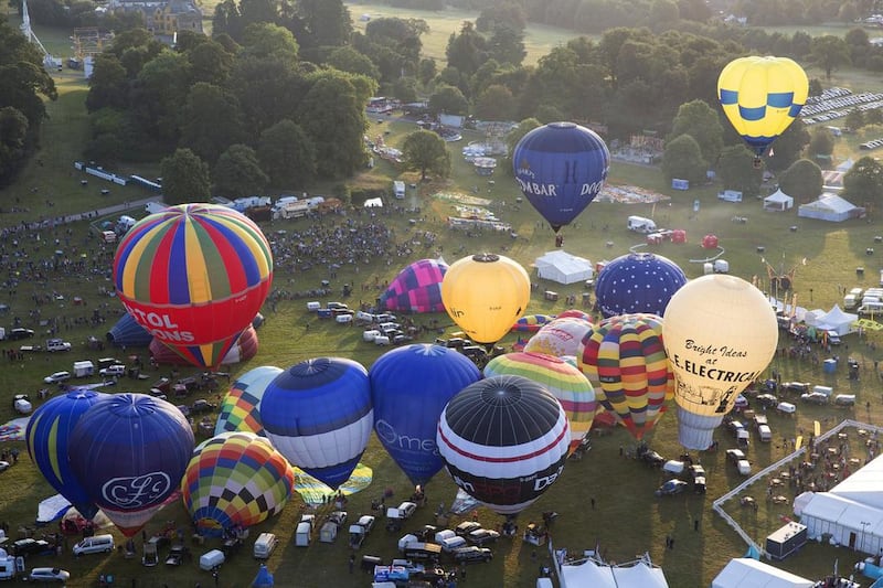 Hot air balloons depart from Aston Court on the first day of the event.