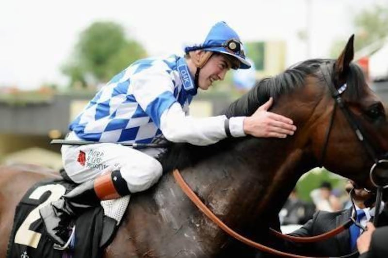 James Doyle gives Al Kazeem a thankful pat after riding the horse to the win in the Prince of Wales Stakes, one of three winners the jockey had on Day 2 at Royal Ascot.