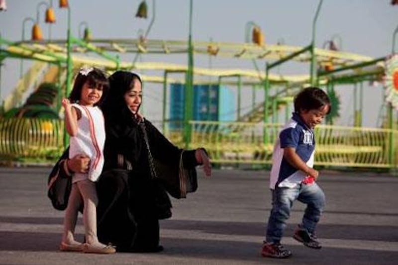 Dubai, United Arab Emirates, December 29, 2012: 
Emirati mother Sarah Al Falasi poses portrait with her son Mohammed, 3, who has Down Syndrome, and her daughter Aljouhara,4, as they spend time together at the Festival City in Dubai, on Saturday, Dec. 29, 2012. Mohammed has been doing well at Inspire Nursery in Dubai.
Silvia Razgova/The National


