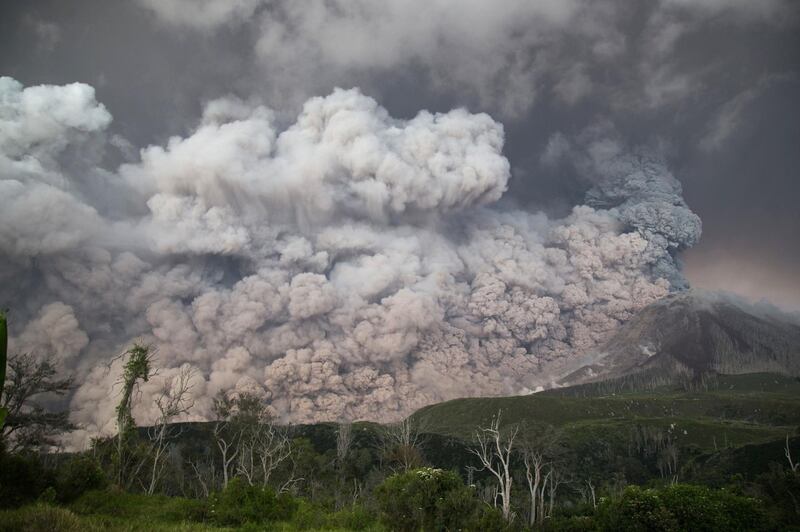 Thick volcanic ash spews into the air from Mount Sinabung volcano in Karo, North Sumatra, on February 19, 2018. Endro Rusharyanto / AFP