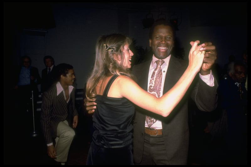 Sidney Poitier dancing with his wife Joanna Shimkus at Studio 54 in 1979. Getty Images