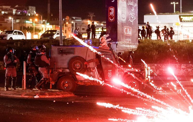 Palestinian protesters launch fireworks at Israeli security forces during confrontations with them in the mostly Arab city of Umm Al Fahm in northern Israel. AFP