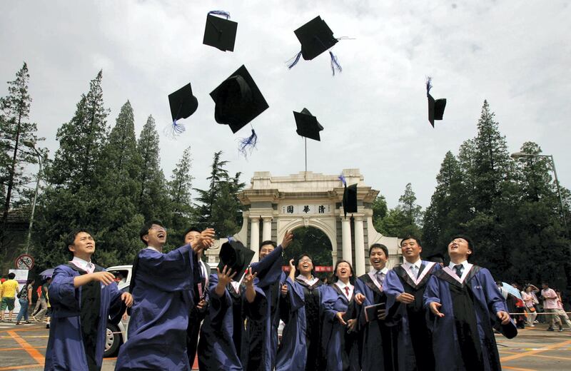BEIJING, CHINA - JULY 18: (CHINA OUT) Students throw their mortar boards into the air as they graduate during a ceremony held at the Tsinghua University on July 18, 2007 in Beijing, China. China faces a major challenge in meeting its goal of creating nine million jobs this year, according to Tian Chengping, Minister of Labour and Social Security. Approximately five million college graduates, the largest number in history, will enter the job market this year, in addition to surplus rural labourers swarming into cities for work. (Photo by China Photos/Getty Images)