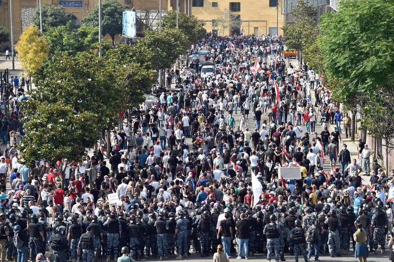 Security forces including Lebanese Army units block a protesters' march during a mass demonstration against the Lebanese government and worsening economic conditions, a road near the Mohammad Al-Amin Mosque, in Beirut, Lebanon.  EPA