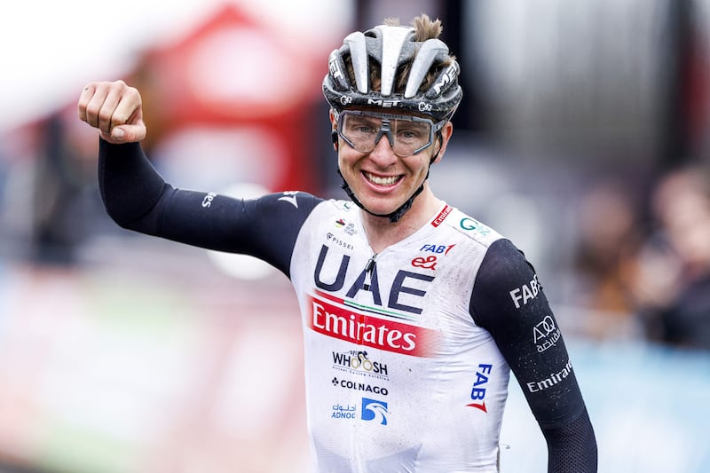 Slovenian cyclist Tadej Pogacar celebrates after winning the Men's 57th Amstel Gold Cycling Race 2023, in Valkenburg, on April 16, 2023. AFP