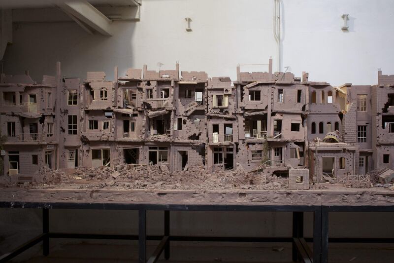 The clay artwork represents a street in Syria that was destroyed by regime forces and their allies.