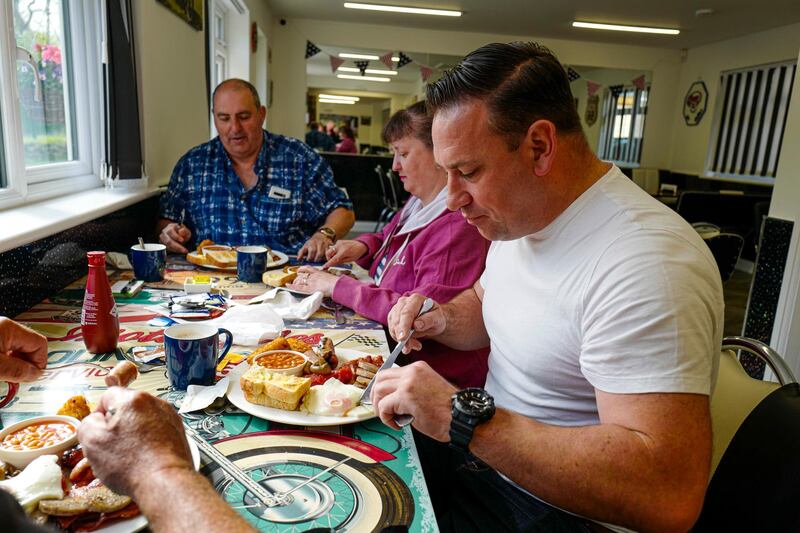 A table of customers are served breakfast at an indoor table in Falmouth, Cornwall, south-west England. Getty Images