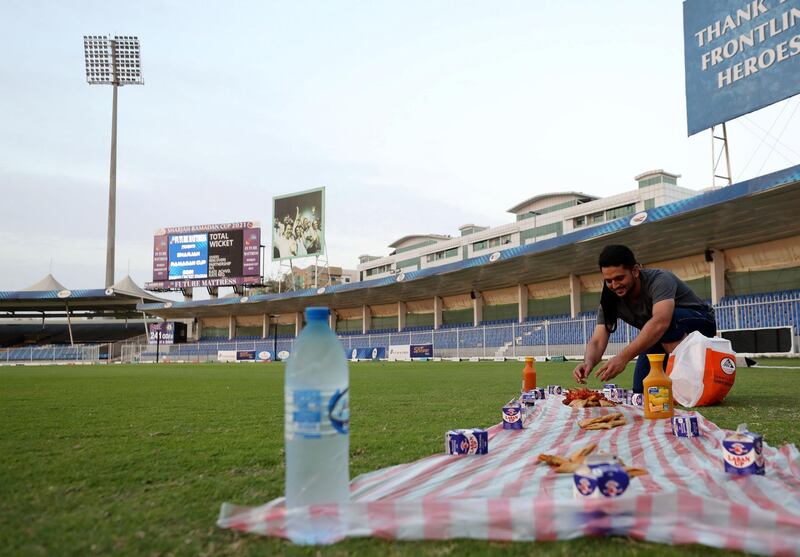A player sets up for Iftar before the Sharjah Ramadan Cup game between MGM Cricket Club v Pacific Group in Sharjah on April 27th, 2021. Chris Whiteoak / The National. 
Reporter: Paul Radley for Sport