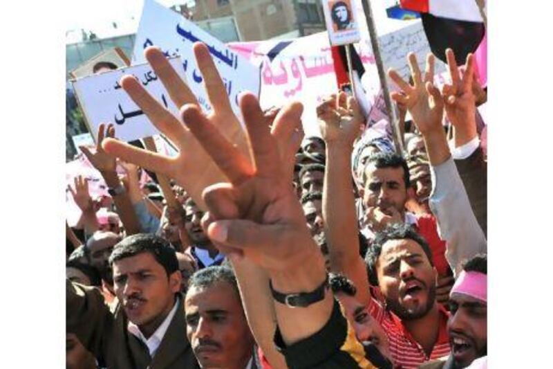 Yemeni protesters give the 'victory' sign during an anti-government demonstration in Sana'a yesterday.