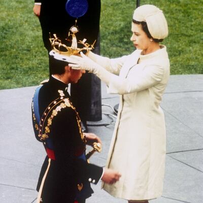 Queen Elizabeth II formally invests her son with the Coronet of the Prince of Wales during an investiture ceremony at Caernarfon Castle in 1969. PA