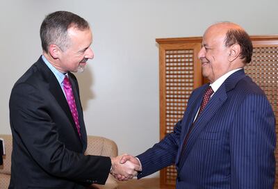 Yemen's President Abd-Rabbu Mansour Hadi, right, shakes hands with the newly-appointed British ambassador to Yemen Edmund Fitton-Brown in Aden in 2015. Reuters