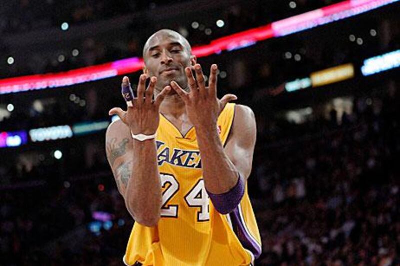 Los Angeles Lakers guard Kobe Bryant looks at his hands after fumbling with the ball. Jae C Hong / AP Photo