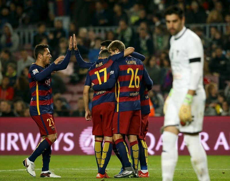Barcelona players celebrate during their 6-1 Copa del Rey win at the Camp Nou on Wednesday night. Albert Gea / Reuters