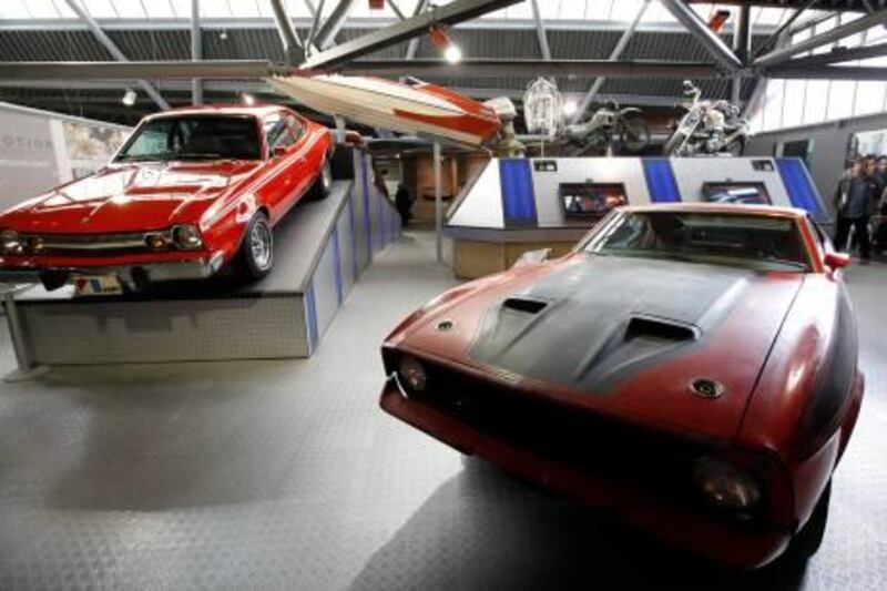 A Ford Mustang Mach 1, right, which featured in the James Bond movie 'Diamonds Are Forever' is seen next to the AMC Hornet, right, which was used in the movie 'The Man with the Golden Gun' are seen on display at the opening of the Bond in Motion 50 vehicles in 50 years exhibition at the National Motor Museum in Beailieu, near Southampton, England Sunday, Jan.15, 2012. (AP Photo/Alastair Grant) *** Local Caption ***  Britain Bond Cars.JPEG-0c655.jpg