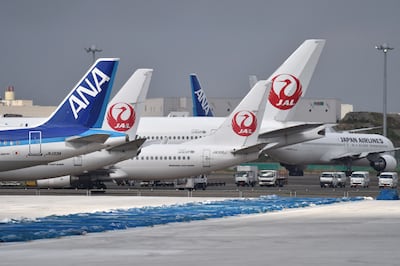 ANA Holdings and Japan Airlines offer shareholders 50 per cent off vouchers for domestic flights with the purchase of at least 100 stock shares. AFP