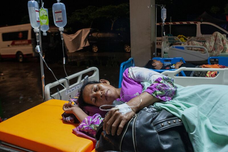 Patients receive medical treatment outside a hospital following the 6.2 magnitude earthquake in Mamuju, West Sulawesi, Indonesia, 15 January 2021. At least 42 people were killed and dozens other injured after the 6.2 earthquake struck Sulawesi island.  EPA