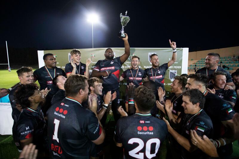 Dubai Exiles celebrate winning the UAE Premiership after beating Dubai Tigers in the final at Al Ain Amblers RFC. Ruel Pableo for The National