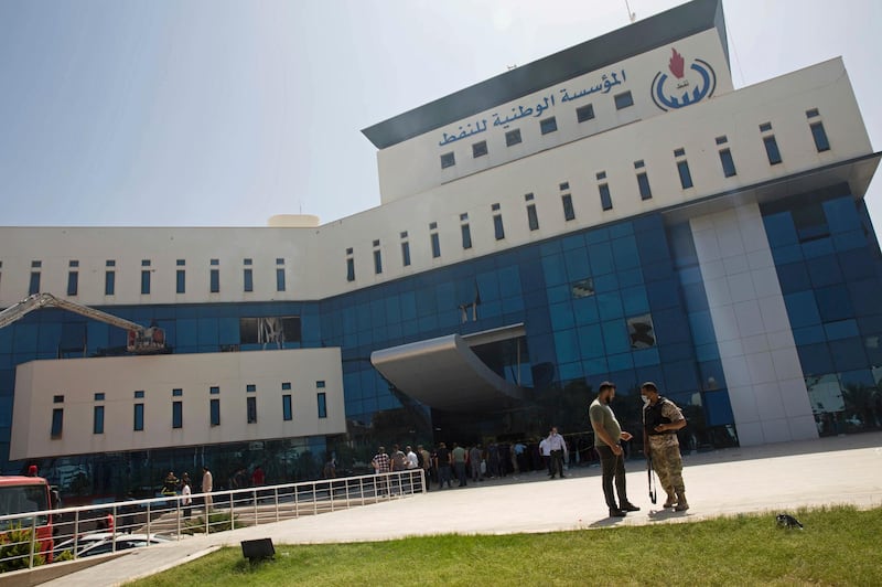 Security forces patrol the headquarters of Libya's National Oil Corporation (NOC) after an attack by gunmen in Tripoli. AP Photo