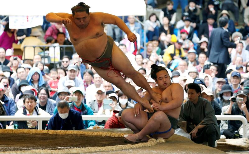 Sumo wrestlers perform at the Yasukuni Shrine in Tokyo, Japan. Toru Hanai / Reuters