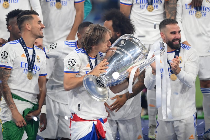 Luka Modric kisses the trophy. Getty