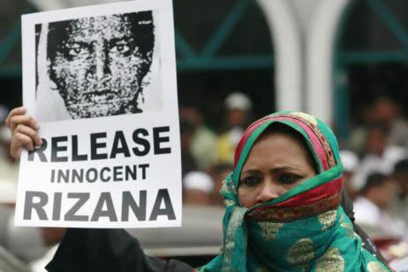 A protester holds an image of Rizana Nafeek during a demonstration demanding her release in front of the Saudi Arabian embassy in Colombo. She was executed on January 9. Dinuka Liyanawatte / Reuters