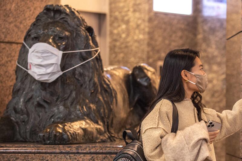 Even the statues are masked in Tokyo's Ginza district, as Japan reported a record high of new Covid-19 infections fuelled by the Omicron variant. AFP