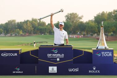 DUBAI, UNITED ARAB EMIRATES - NOVEMBER 19: Nicolai Hojgaard of Denmark lifts the DP World Tour Championship trophy on the 18th green during Day Four of the DP World Tour Championship on the Earth Course at Jumeirah Golf Estates on November 19, 2023 in Dubai, United Arab Emirates. (Photo by Andrew Redington / Getty Images)