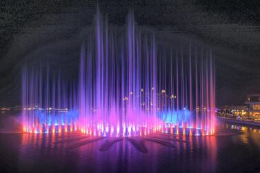 The Palm Fountain in Dubai is dotted with a number of restaurants with views of the water, light and sound show.